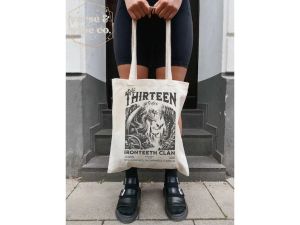 The Thirteen Tote Bag Throne of Glass T-Shirt Authorized Merchandising from SJM Manon Blackbeak T-Shirt Ironteeth Witches Terrasen Bookish ACOTAR Beach Bag