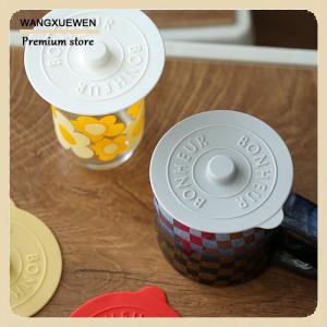 [COD] ถ้วยแก้วซิลิโคนอเนกประสงค์1ชิ้นฝาปิดกันความร้อนถนอมอุณหภูมิสำหรับถ้วยกาแฟ นมพร้อมที่จับนูน