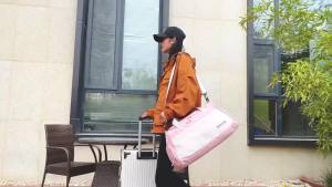 Large bag for traveling can be worn over the shoulder waterproof has separate compartments for dry and wet items and a shoe compartment. travel bag-152c4c8b
