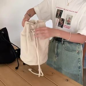 Korean style ins Fresh and sweet matching styles for spring and summer 2026 Canvas pocket bag fashionable drawstring bucket crossbody bag