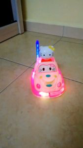 .NEW TOY HELLO KITTY CAR WITH LIGHTING & MUSIC