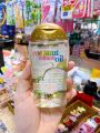 Tinh dầu dưỡng tóc OGX Coconut Miracle Oil.