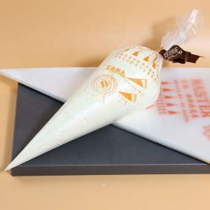 100Pcs/Set Disposable Piping Pastry Bag Icing Fondant Cup Cake Cream Decorating Cupcake Squeeze Tip Tool 一次性裱花袋