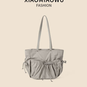 กระเป๋าทรง Tote ( 12 ) เเบบผ้าเเต่งโบว์เเละกระเป๋าด้านหน้า ทรงเรียบสไตส์สาวหวานเเต่สะมภาระเยอะ ใส่ไอเเพดได้ เหมาะสำหรับสายหวานน่ารักกุ๊บกิ๊บ
