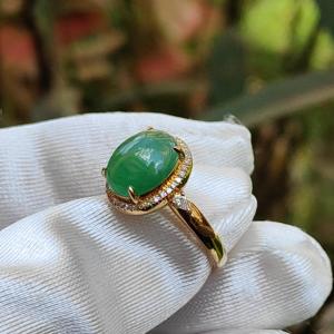18K Gold weigh 2 grams Setting with Natural Type A Jadeite Green Cabochon size 10.7 * 8.3 * 3.8 mm with 35 * 0.003 and 2 * 0.03 pear cut diamonds certificate included weigh 2.65 grams Finger ring size 17.3 mm
