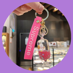 Móc khóa cún con trong hình viên kẹo xinh xắn dễ thương