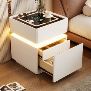 JUANS HOMEModern bedside table with lamp and cup on top. Sleek design with illuminated drawers. Suitable for bedroom use.