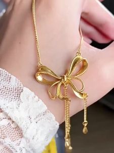 New style fugitive princess bow necklace with gold-plated pendant heart-shaped tassel integrated chain clavicle chain light luxury and elegant