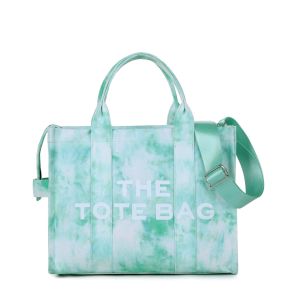 Túi tote nữ đeo vai họa tiết chữ cái mẫu mới xuyên biên giới túi vải canvas nhuộm loang đơn giản dung tích lớn dùng đi làm có thể đeo vai hoặc đeo chéo.