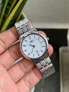 Đồng hồ nữ Technos mặt trắng men chạy pin hàng Si