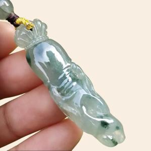 High Quality Light Green with Green Natural Type A Jadeite Jade crafted with shape of Ginseng as Pendant certificate weighs 7.63 grams measurement 48.2 * 12.7 * 7.1 mm (pendant277)