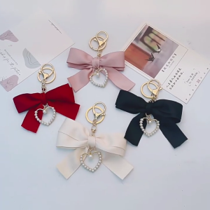Sturdy Alloy Pearls Heart Ribbon Bowknot Keychain Pendnat Designed For Trendy Women Who Love Individualized