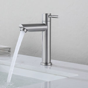 Stainless steel modern faucet with single handle sleek design water flowing mounted on white marble countertop.