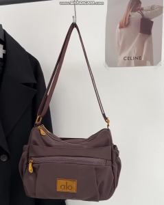 2026 New Alo Multi Compartment Shoulder Bag Ladies Lightweight Wrinkle Nylon Metal Plate Logo Multiple Front Pockets Outdoor Shopping Gym Commute Crossbody Bag