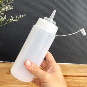 Có VẠCH I Bình chai đựng sốt  tương ớt- nước đường - sữa đặc . Nhựa dày  nhiều size 400ml 600ml 900ml