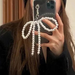 พวงกุญแจโบว์โลหะบัลเล่ต์ Ins กระเป๋าผูกโบว์ริบบิ้นไข่มุกที่ประณีตจี้ริบบิ้นโบว์เครื่องประดับสร้อยคอรูปโทรศัพท์