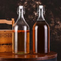 Chai thủy tinh Giara tròn bầu nắp gài 500ml 1000ml. 