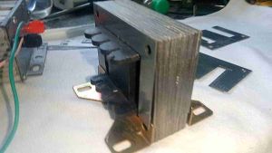 3AMPERE TRANSFORMER EI CORE  WITH BOBBINS AND FOOTING BRACKET.