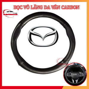Bọc vô lăng Carbon có đính kèm logo MAZDA màu đen chất liệu da dày dặn thiết kế bắt mắt Giúp bảo vệ bọc vô lăng nguyên bản một cách tối ưu