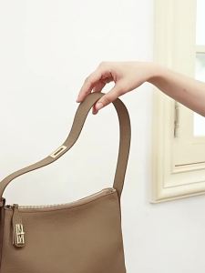 2026 Womens Daily Bag Medium Size European-American Retro Style First Layer Cowhide Dumpling Bag with Lock Decoration Shoulder and Crossbody Bag