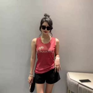 Ammin เสื้อสีทึบคอกลมแขนกุดสำหรับผู้หญิงเสื้อเบลาส์เสื้อยืดผ้าฝ้ายสไตล์เกาหลีปักลายดอกไม้ดีไซน์เรียบหรูขนาดใหญ่พิเศษสำหรับฤดูร้อน2024