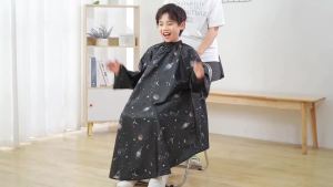 PERFEHAIR Kids Hair Cutting Cape with Sleeves Kids Barber Cape Haircut Cape for Boy & Girls Professional Salon or Home Hair Cut Cape-Black Space Printing