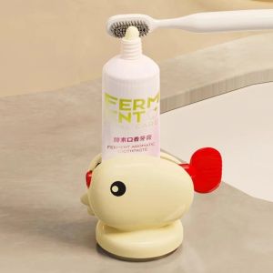 Dụng cụ nặn kem đánh răng kẹp tuýp kem hình cá dễ thương – đế hút chân không tiện lợi tiết kiệm