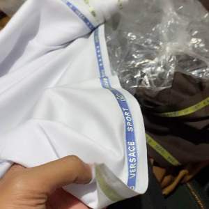 Kain hitam putih bersih versace sport exlusive bahan seragam dinas