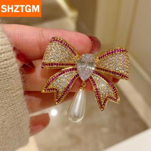 [COD] SHZTGM เข็มกลัดติดโบว์ประดับพลอยเทียมอารมณ์สำหรับผู้หญิงแฟชั่นสาวๆเข็มกลัดชุดสูทหรูหราของขวัญเสื้อผ้า