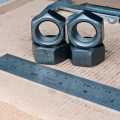 MUR KUNCI 32 M22 BAJA HITAM UNTUK BAUT 32 M22 PITCH DRAT 2.5 DIAMETER LUAR 32MM DIAMETER DALAM LUBANG 22MM. 