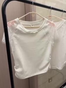 French cotton short-sleeved T-shirt female summer new fashion lace openwork gauze round neck stitching white short coat.2026