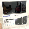 Lò vi sóng có nướng Samsung MG23K3515AS/SV dung tích 23 Lít, sản xuất Malaysia. 