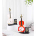 Đồng hồ báo thức để bàn kèm hộp đựng bút hình cây đàn violin dùng trang trí decor bàn học hay bàn làm việc. 