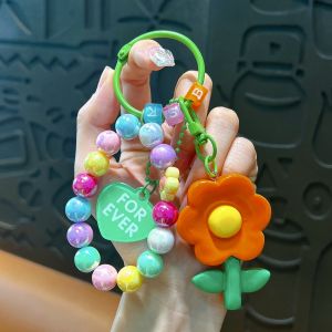 Sunshine ลูกปัดดอกไม้พวงกุญแจสี Candy กระเป๋ารถพวงกุญแจเรซิ่นจี้วงกลมแขวนเครื่องประดับแฟชั่นเครื่องประดับอุปกรณ์เสริม403