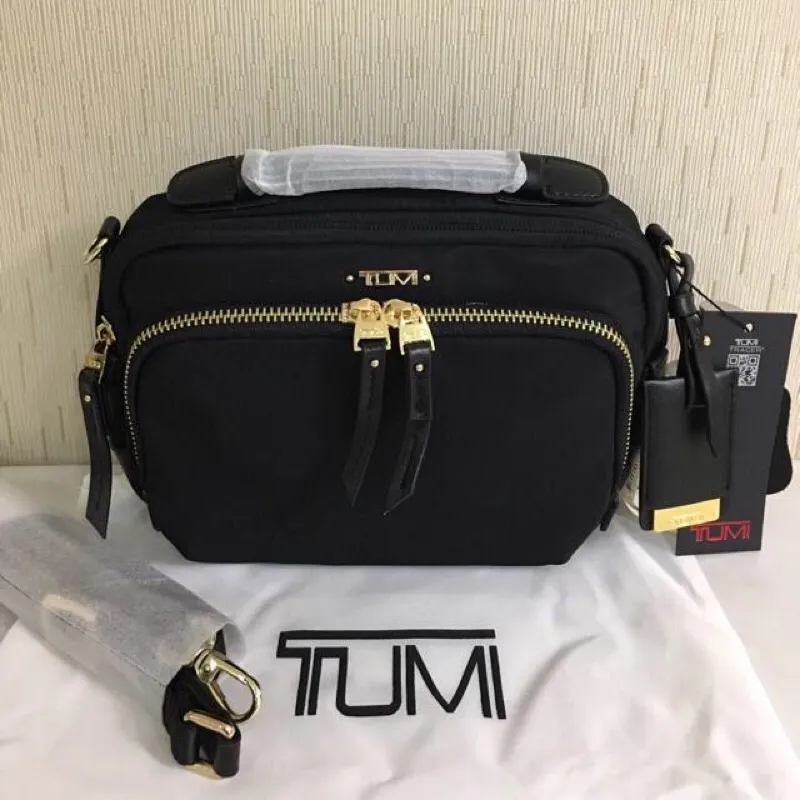 Tumi sling store bag women