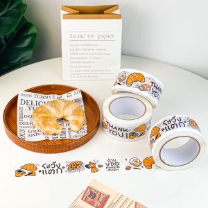 เทปเสียงเบา กาวเหนียว ดึงง่าย สีขาว ลายครัวซองค์ ขนาด 100 หลา พร้อมส่ง