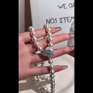 AE Adjustable pearl sweater chain elegant and high-end long autumn and winter necklace for women versatile and sophisticated alloy accessory