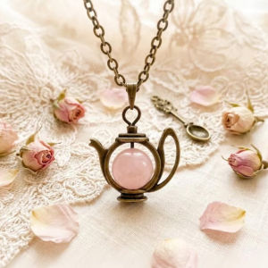 European and American antique bronze teapot and rose quartz necklace a delicate and unique pendant featuring natural gemstones inspired by Alice in Wonderland
