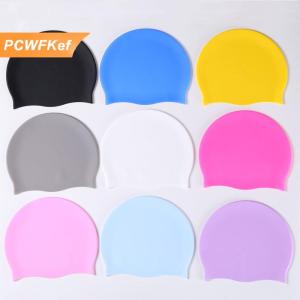 【PCWFKef】 หมวกว่ายน้ำซิลิโคนโลกผู้ชายผู้หญิงผมยาวกันน้ำสีกีฬายืดหยุ่นสูงหมวกว่ายน้ำสระว่ายน้ำผู้ใหญ่หมวกดำน้ำ
