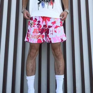 กางเกงขาสั้นผู้ชายสไตล์อเมริกัน ลายพรางสำหรับใส่เล่นกีฬา ระบายอากาศได้ดี สีเขียวและสีชมพู