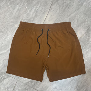 ขาสั้นยิมผู้ชายคุณภาพสูงจากผ้าทาสลาน – ขาสั้นเบอร์มิวดาแห้งเร็วและยืดหยุ่นสำหรับกีฬา ฤดูร้อนชายหาดสบายๆ