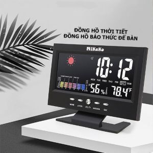 Đồng hồ thời tiết Mikako với màn hình kỹ thuật số hiển thị giờ ngày nhiệt độ độ ẩm và các biểu tượng thời tiết.