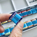 Lukas Travel Watercolor Paint 24 Colors Half Pans Transparent Watercolor Painting Brush Sketchers' Portable Palette Metal Box. 