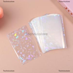 [COD] Technicolore 100ชิ้น ล็อตแผ่นฟอยล์รูปหัวใจเลเซอร์บรรจุกระสุน TCG การ์ดแขนเสื้อบอร์ดเล่นเกมรูปภาพกรอบป้องกันการซื้อขาย