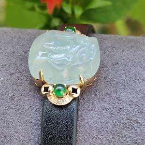 Light Green Hue Natural Type A Jadeite Jade crafted as Pixiu set on 18k Gold with 2 Green Cabochon and diamonds adding PU wrist band upgraded elegant style bracelet certificate weigh 4.44 grams measurement 16.6 * 14.1 * 7.5 mm (18kpw1)