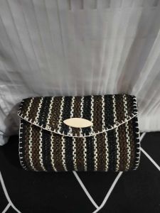 Handmade woven sling bags with striped pattern in green brown beige and black colors.
