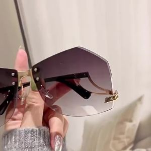欧美新款无框太阳镜女时尚个性潮流镂空镜腿不规则海洋片太阳眼镜