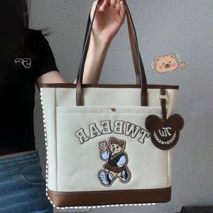 PUREGLOW สำหรับนักเรียน แบบพกพาได้ วรรณกรรมสำหรับเด็ก กระเป๋าหนังสือช้อปปิ้ง สไตล์วิทยาลัย หนังพียู ถุงเก็บสัมภาระ ตัวอักษรสำหรับเด็ก การพิมพ์ลาย กระเป๋าถือสำหรับผู้หญิง กระเป๋าโท้ท กระเป๋าผ้าใบเกาหลี กระเป๋าสะพายไหล่สำหรับผู้หญิง