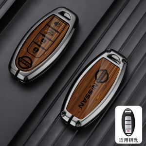 กรอบเคสกุญแจรถยนต์โลหะสังกะสีผสมสำหรับ Nissan Xtrail Almera Serena March Micra Livina Juke โน้ตลูกเต๋าใบ Kicks Terra Tiida พวงกุญแจแฟชั่นปลอกป้องกันลายไม้มันวาว