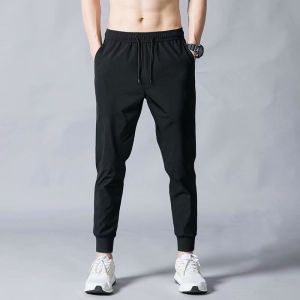 Dry ice silk pants mens thin section casual pants tight fried Street feet niche sports pants sense fashionable design